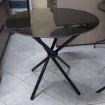 Round dark glass dining table
